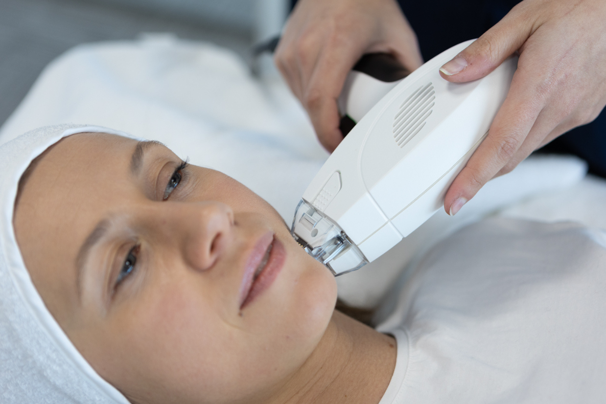 Woman receiving a skin treatment in Mount Waverley medical aesthetics clinic.