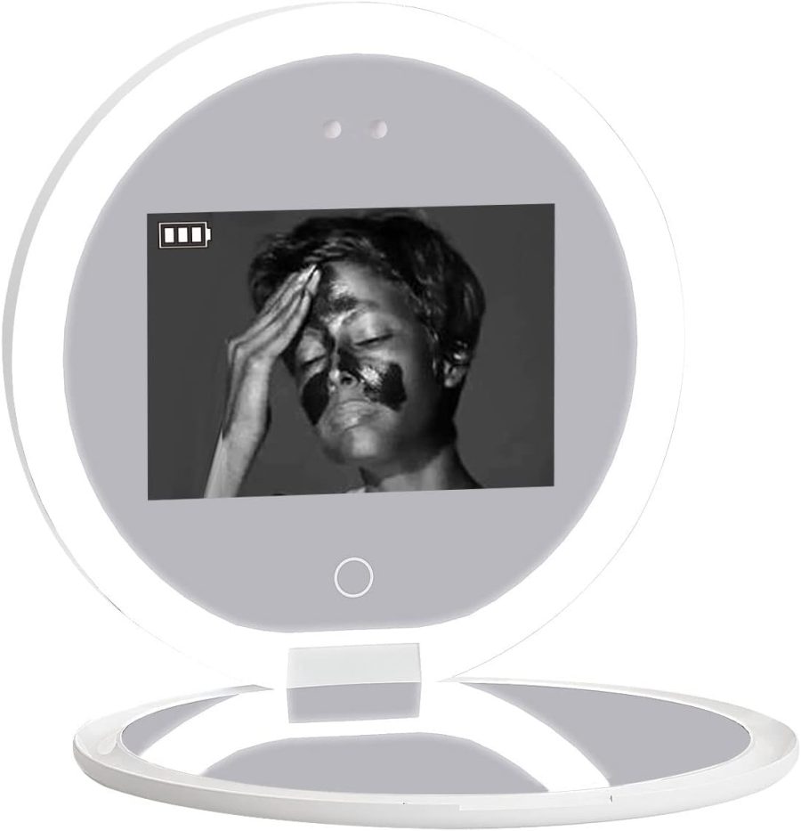 Face mask treatment shown in a sleek digital mirror display.