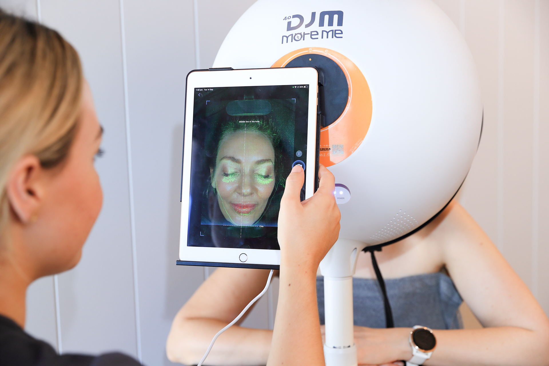 Client receiving a facial scan at a Mount Waverley aesthetics clinic.